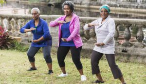 Senior black women practicing Tai Chi